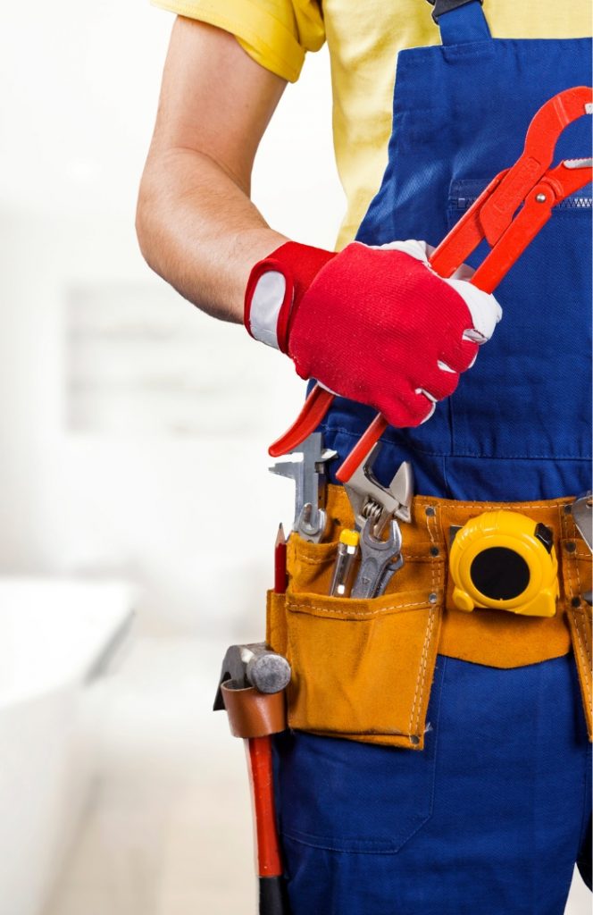 Plumber fixing a burst pipe – emergency plumber in Kensington